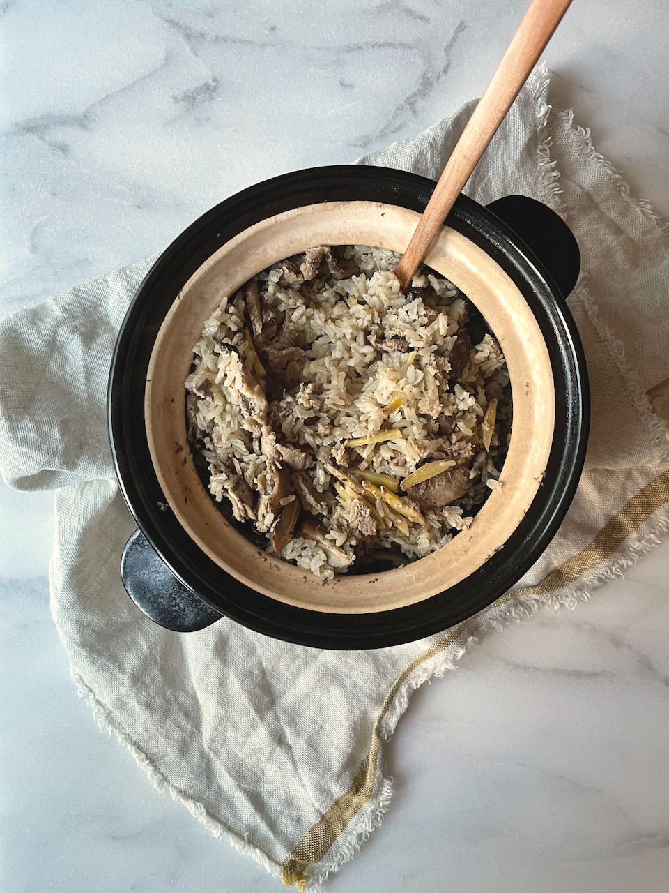 Beef rice and mushroom with ginger in a Donabe